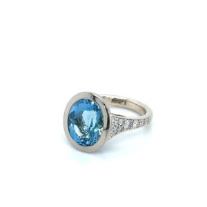Oval cut aquamarine and diamond ring